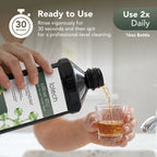 Pouring ioRinse RTU Green Apple into a glass: rinse 30 seconds, use twice daily