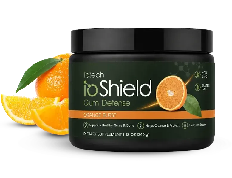 ioShield Gum Defense Orange Burst jar with fresh orange slices